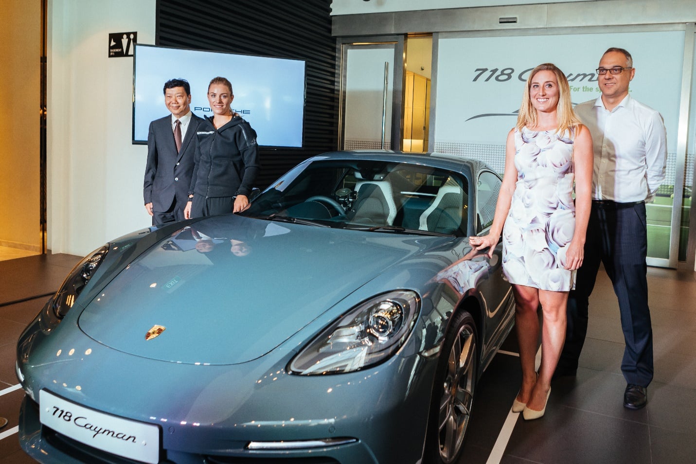 From left to right - Francis Lee, Managing Director of Stuttgart Auto; Angelique Kerber; Melissa Pine, Vice-President of WTA Asia-Pacific and Tournament Director of the WTA Finals, and Henrik Dreier, General Manager, Porsche Singapore.